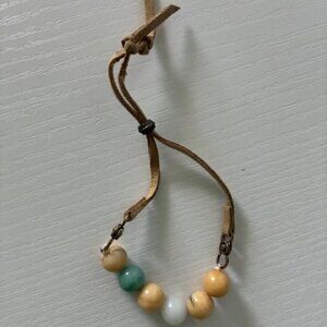 Bracelet - soft tan leather band with peach and tan beads. Expandable!
